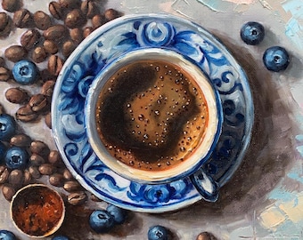 May include: An overhead view of a still-life painting featuring a cup of coffee on a blue and white patterned saucer. Scattered around are coffee beans and fresh blueberries. The painting has a textured, artistic style.