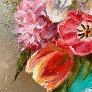 May include: A close-up of a still life painting featuring a bouquet of pink, white, and red flowers in a teal vase. The flowers are painted with thick brushstrokes, giving the painting a textured look.
