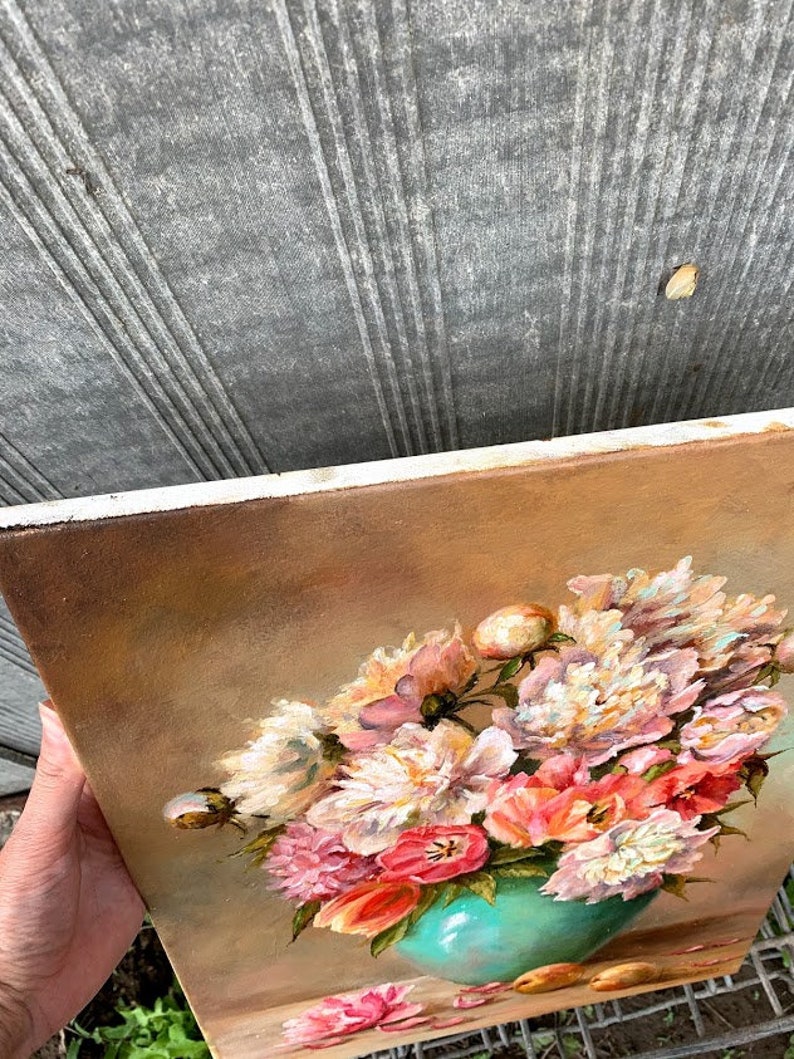 May include: A painting of a bouquet of pink, white, and peach peonies in a teal vase. The flowers are arranged in a loose, natural style and are set against a warm, brown background.