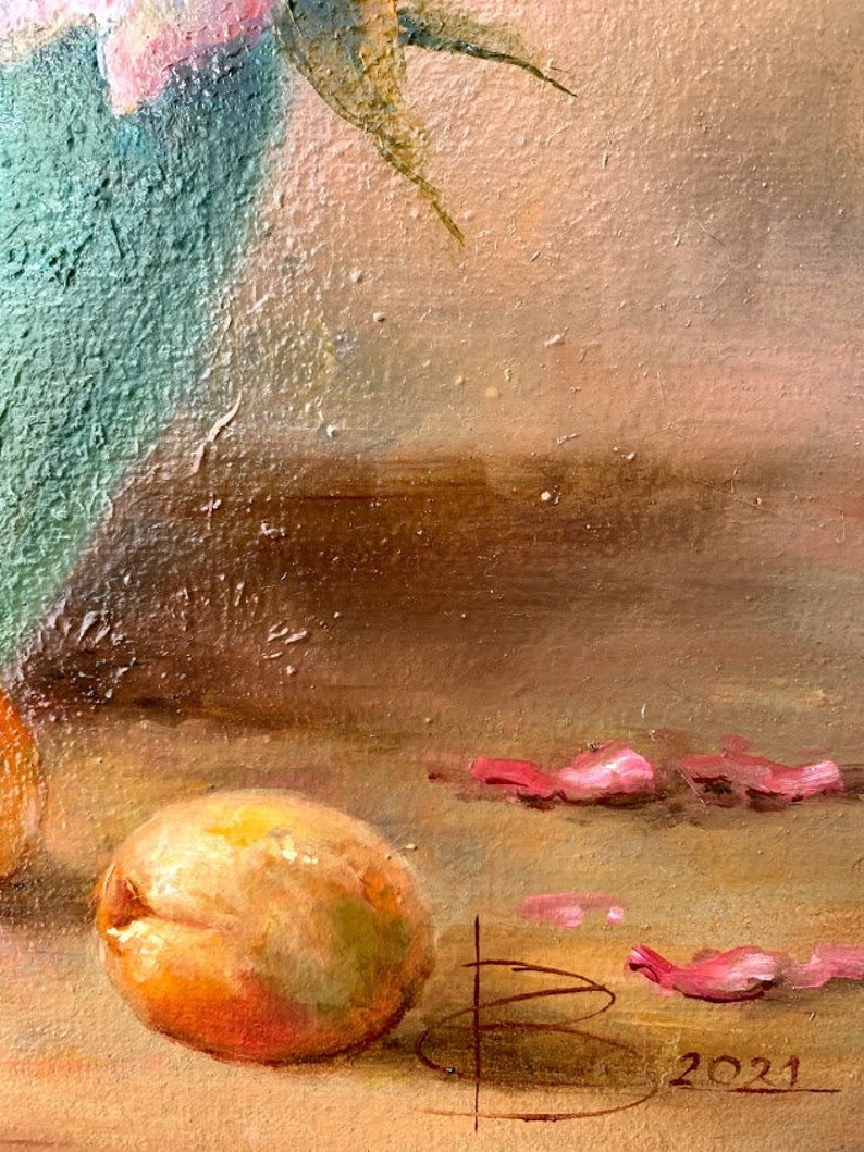 May include: A still life painting of a peach, pink flower petals, and a vase. The vase is a teal blue color and the peach is a light orange color. The painting is signed with the letter "B" and the year "2021".