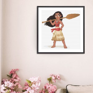 May include: A framed pixel art print depicting a Polynesian woman with a wooden oar. She is dressed in a red top, a tan skirt, and a necklace. The artwork is set against a white background within a black frame.