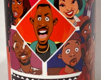 May include: White ceramic mug featuring cartoon illustrations of characters from the TV show "Martin". The mug has a red, green, and white background with the word "MARTIN" in large letters at the bottom.