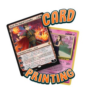 May include: Two custom trading cards. One card features a person with flames and the text "Fred, The Digital Crusader." The other card is pink with a person and cherry blossoms. The word "CARD" and "PRINTING" are in orange text.