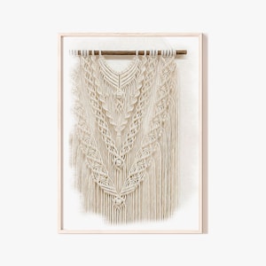 May include: A white macrame wall hanging with a geometric pattern, framed in a light wood frame.