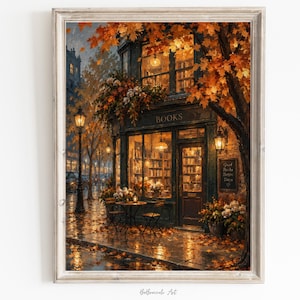 May include: A framed art print depicting a bookstore exterior during autumn. The storefront features large windows, a door, and a sign reading BOOKS. A chalkboard sign reads Good Books Better Days. Orange leaves cover the ground and tree branches.
