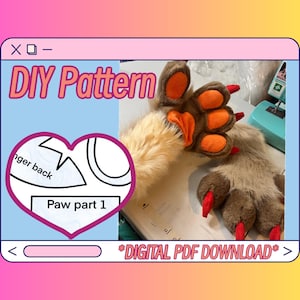 Könnte beinhalten: DIY-Muster für eine Fellpfote. Das Bild zeigt ein herzförmiges Diagramm mit dem Text "Paw part 1" und "nger back". Die fertige Pfote ist braun und hellbraun mit orangefarbenen Pads und roten Krallen. Der Text "DIGITAL PDF DOWNLOAD" ist ebenfalls sichtbar.