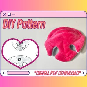 May include: A digital PDF download pattern for a pink plush dog nose. The pattern includes a heart-shaped template with the text "K9" and "Ruffo Cat Creations".