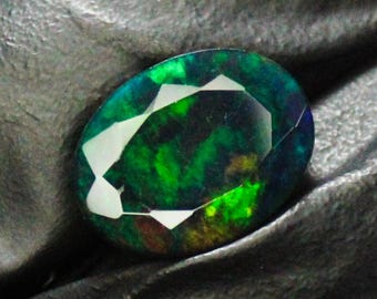 Faceted Black Opal: Oval Green Fire Gemstone, 4.00 Carats