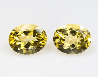 Natural Faceted Yellow Citrine Pair: Oval Gemstones, 5.60 Carats
