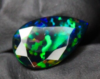 Faceted Black Opal Pear Cut Stone: 3.22 Carats, 15x9x5 mm