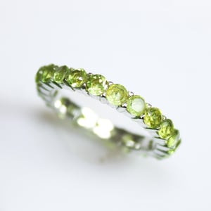 Natural Green Peridot Ring: Sterling Silver Band with Cubic Zirconia