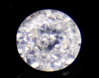 Faceted White Zircon: 1.40 Carat Round Gemstone, 6x6x4 mm