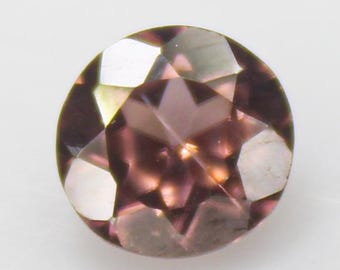 Faceted Brown Zircon: Round Gemstone, 1.15 Carats, 6x6x4 mm