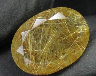 Faceted Golden Rutile Quartz: Oval Gemstone, 6.10 Carats