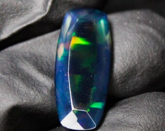Faceted Black Opal: Red Fire Cushion Cut Gemstone (3.88 Carats, 21x9x4 mm