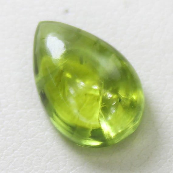 Natural Green Peridot Cabochon: 4.30 Carat Pear-Shaped Gemstone 12x8x5 mm Size