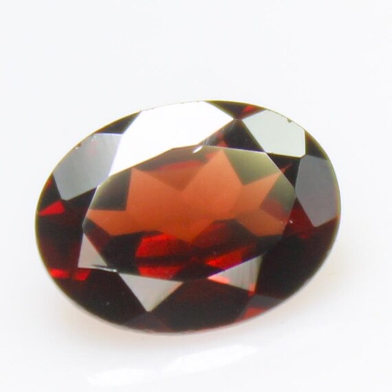 Faceted Red Mozambique Garnet: Oval Gemstone, 1.30 Carats