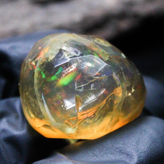 Ethiopian Opal Specimen: Faceted Raw Multi Fire Opal (28x23x17 MM, 63.15 Carats