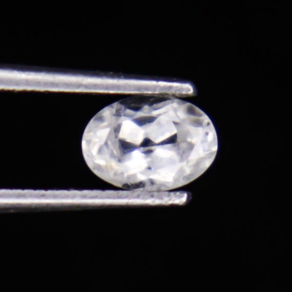 Faceted White Zircon: Oval Gemstone, 1.35 Carats, 7x5x4 mm