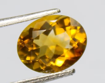 Faceted Citrine Gemstone: Natural Yellow Oval Stone, 2.35 Carat