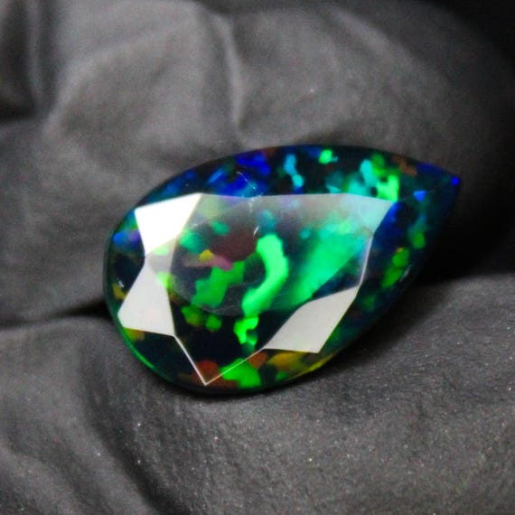 Faceted Black Opal Pear Cut Stone: 3.22 Carats, 15x9x5 mm