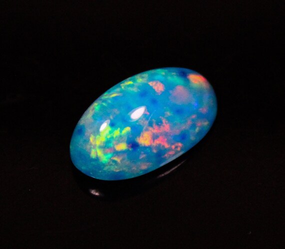 Natural Ethiopian Opal Cabochon: Oval Blue Gemstone (5.80 Ct, 17x9x7 MM)
