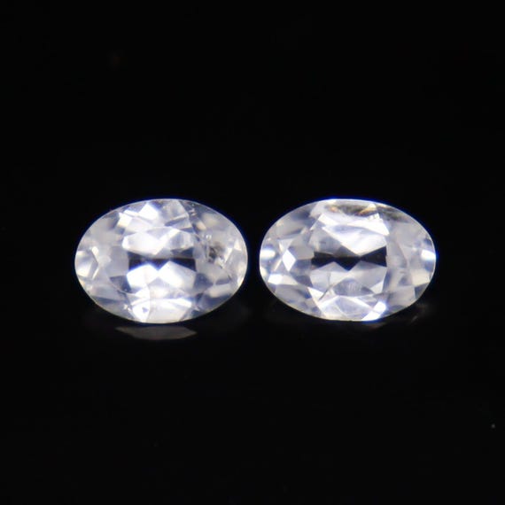 Faceted White Zircon Pair: Oval Gemstones, 2.35 Carats