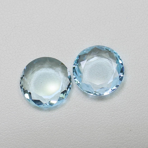 Natural Sky Blue Topaz Pair: Round Faceted Gemstones, 8.55 Carats