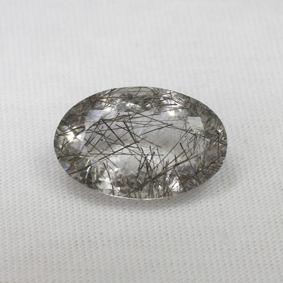 Black Rutile Quartz Faceted Oval: 9.35 Carat Gemstone