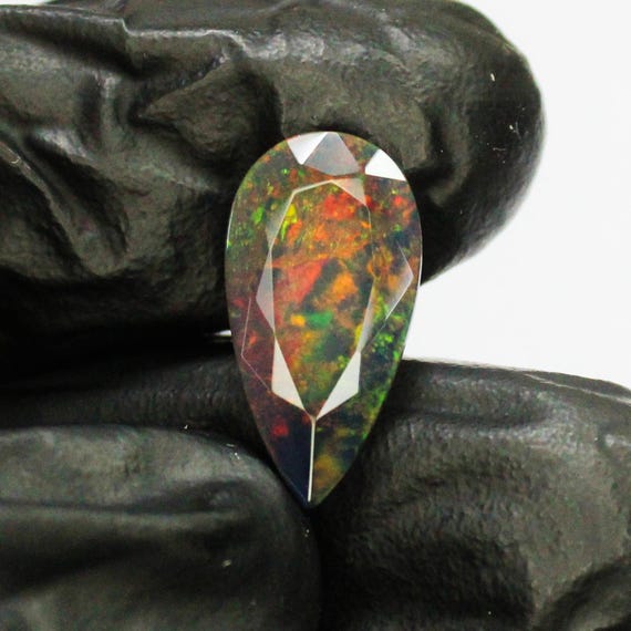 Faceted Black Opal Pear Cabochon: Red Fire, 3.85 Carats