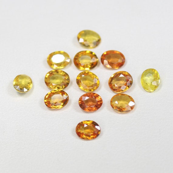 Natural Orange Sapphire Lot: Faceted Oval Gemstones, 4.60 Carats