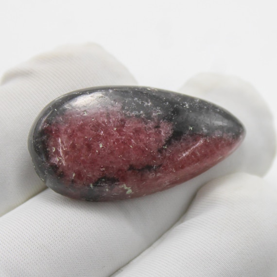 Natural Rhodonite Cabochon: AAA+ pear Gemstone, 34.50 Carat 32x17x6 mm Size