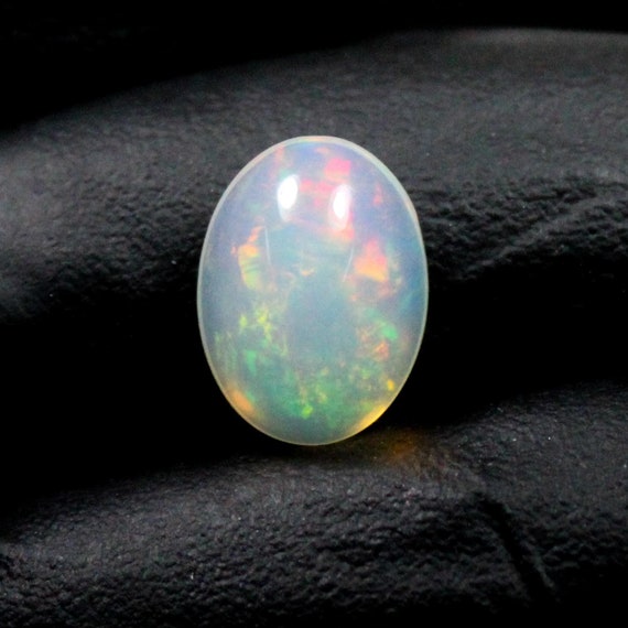 Welo Opal Cabochon: Natural Oval Multi-Fire Gemstone, 2.40 CTS (12x9x5 MM)