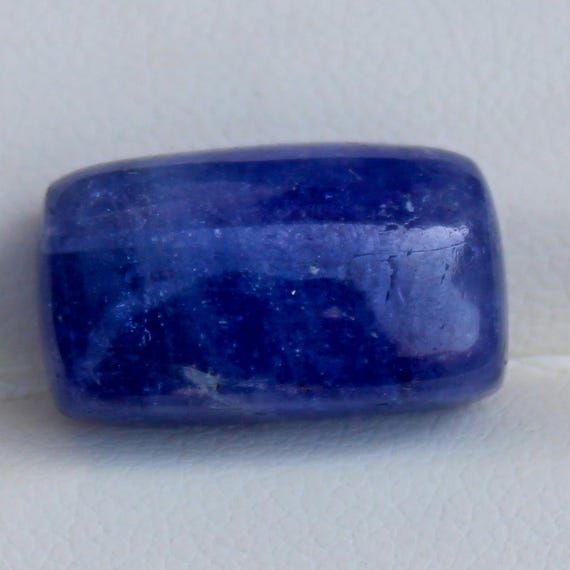 Natural Blue Tanzanite Cabochon: 12.55 Carat In Cushion Shape Gemstone, 16x10x6 mm