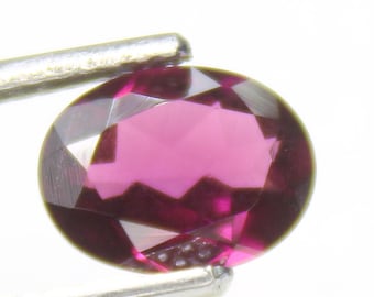 Faceted Pink Rhodolite Garnet: Oval Gemstone, 1.80 Carats
