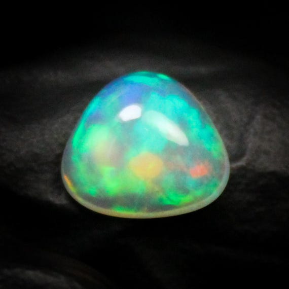 White Ethiopian Opal Cabochon: Fancy Shape, 1.25 Carats, 9x9x5 mm
