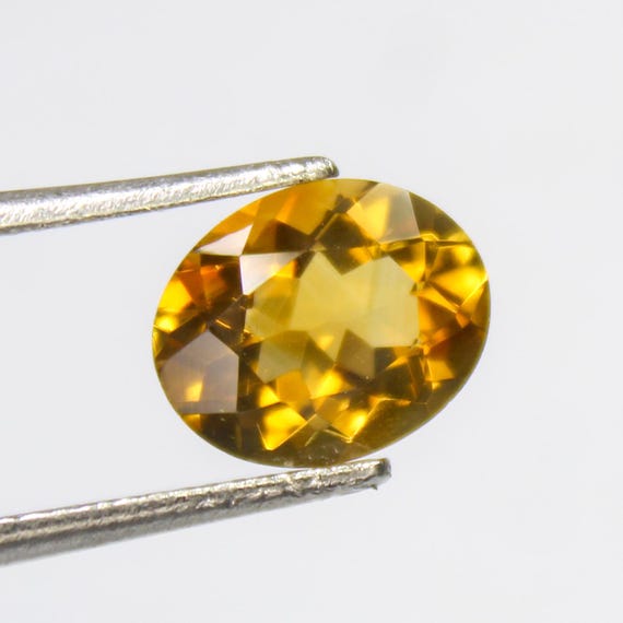 Faceted Citrine Gemstone: Natural Yellow Oval Stone, 2.35 Carat