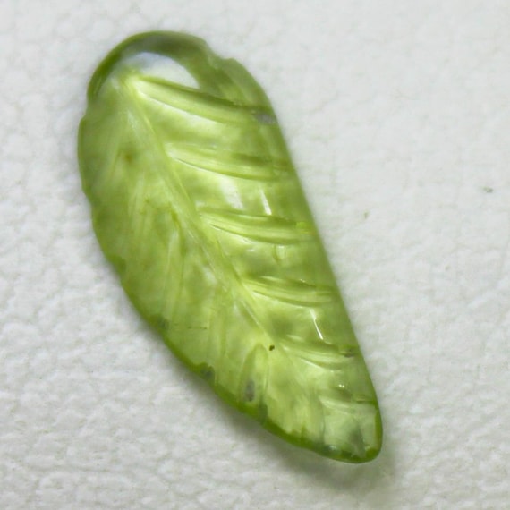 Natural Green Peridot Carving: 0.80 Carat Fancy-Shape Gemstone 11x4x2 mm Size