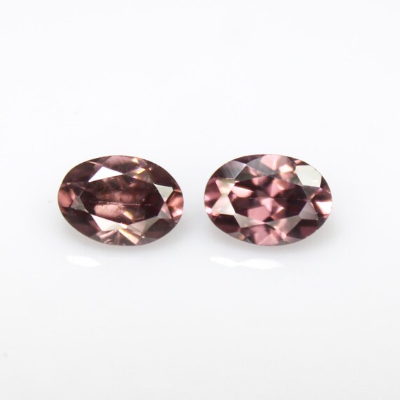 Faceted Brown Zircon Pair: 2.55 Carats, 7x5mm Oval Gemstones