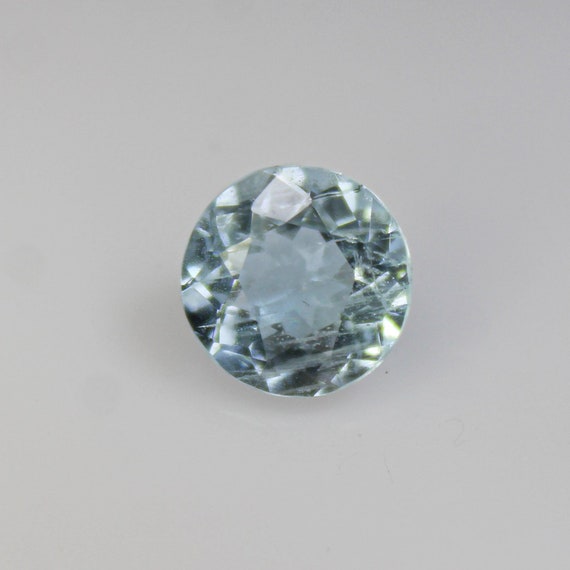 Faceted Round Aquamarine Gemstone: 2.60 Carats, 9x9x5 mm
