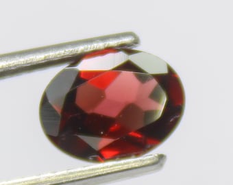 Faceted Red Mozambique Garnet: Oval Gemstone, 1.20 Carats