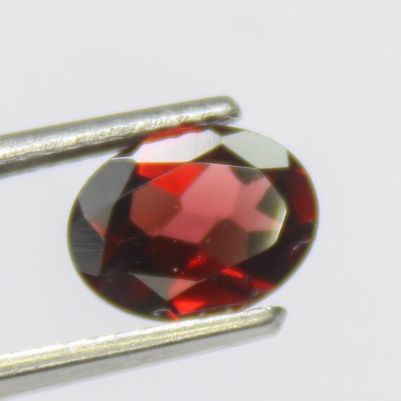Faceted Red Mozambique Garnet: Oval Gemstone, 1.20 Carats