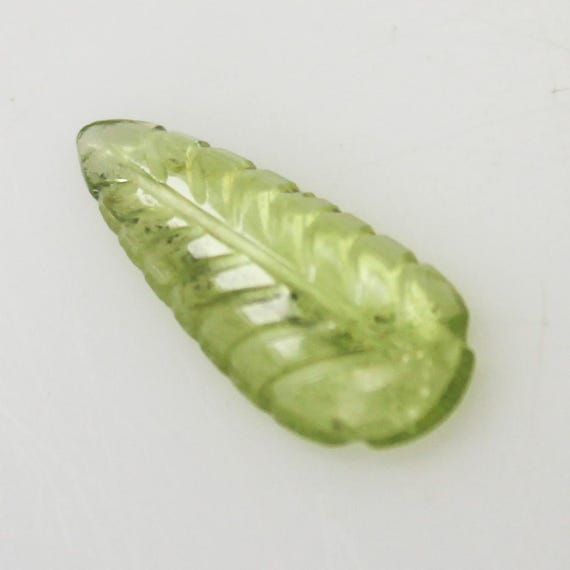 Natural Green Peridot Carving: 1.25 Carat Fancy-Shape Gemstone 13x5x2 mm Size
