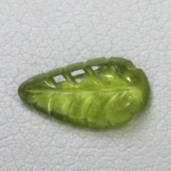 Natural Green Peridot Carving: 0.70 Carat Fancy-Shape Gemstone 9x5x2 mm Size