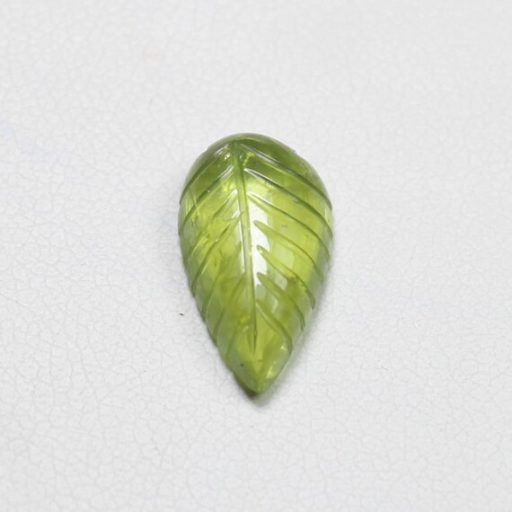 Green Peridot Leaf Carving: Natural Gemstone Jewelry Piece (4.45 Carats, 14x8x5 mm