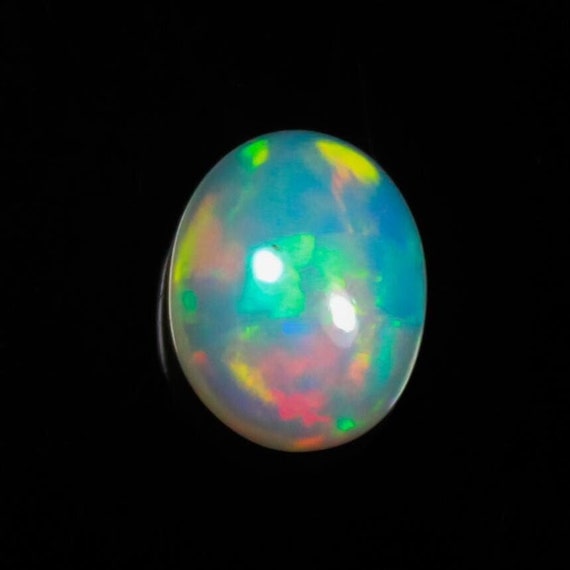 Welo Fire Opal Cabochon: 2.30 Carat Oval, Multi Fire