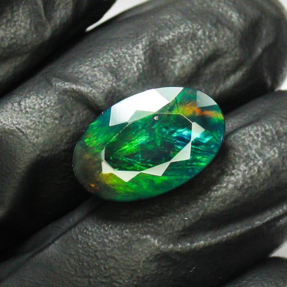 Faceted Black Opal: Oval Cut Green Fire Gemstone, 4.33 Carats