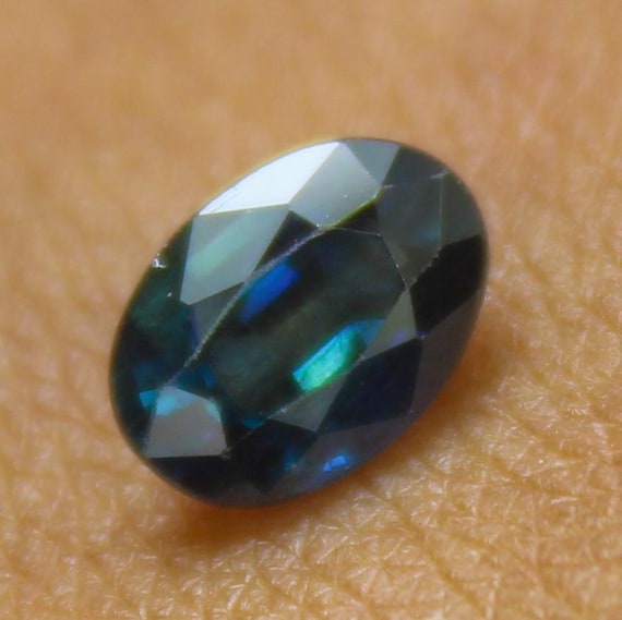 Faceted Oval Blue Sapphire Gemstone: 1.0 ct, 7x5x3 mm