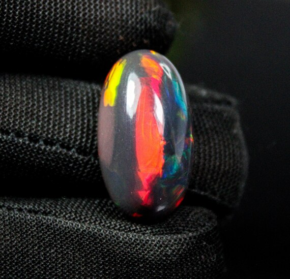 Oval Ethiopian Black Opal Cabochon Stone: Natural Red Fire (13.15 Cts, 24x13x9 MM)