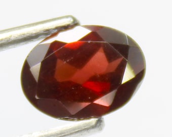 Faceted Red Mozambique Garnet: Oval Gemstone, 1.30 Carats